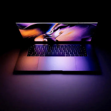 Laptop with a colorful display on a dark background