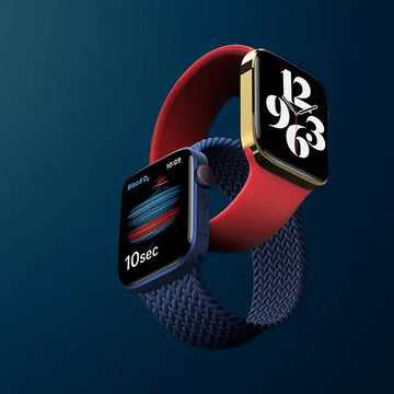 Smartwatch with red and blue bands on a dark blue background