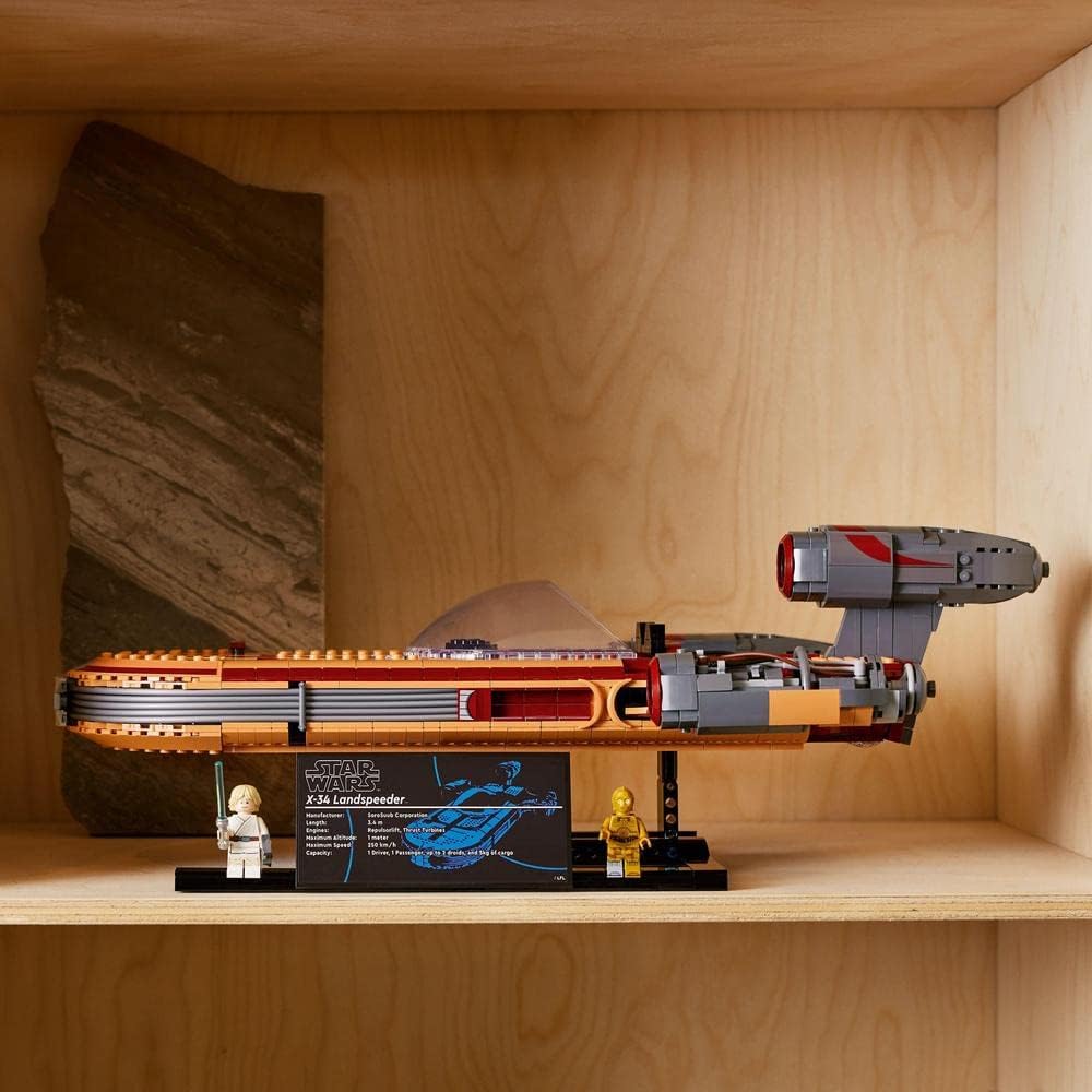 LEGO Star Wars Landspeeder on display shelf with minifigures and info plaque